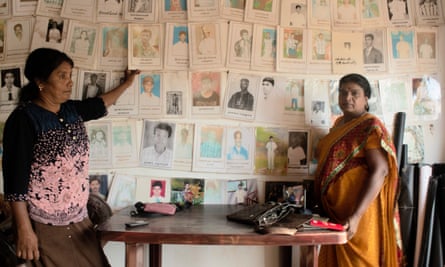Mariasuresh Eswari points to her husband’s photograph, one of the thousands who disappeared in Mullaitivu during the war