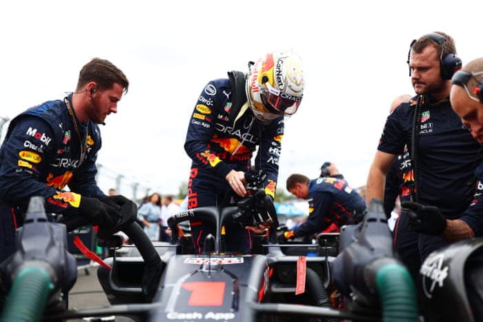Max Verstappen gets into his Red Bull.