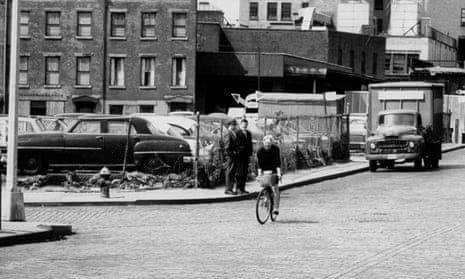Jane Jacobs riding a bicycle in New York.