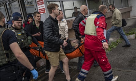 An injured man on a stretcher in Ukraine