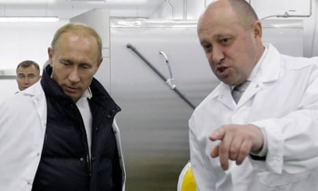 Yevgeny Prigozhin (right), who founded the group, with Vladimir Putin.