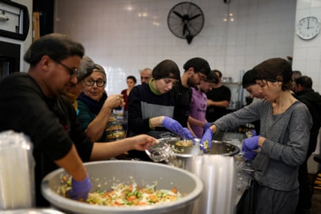 Volunteers prepare meals at the community kitchen Nation Station for displaced people and refugees in Beirut, Lebanon.