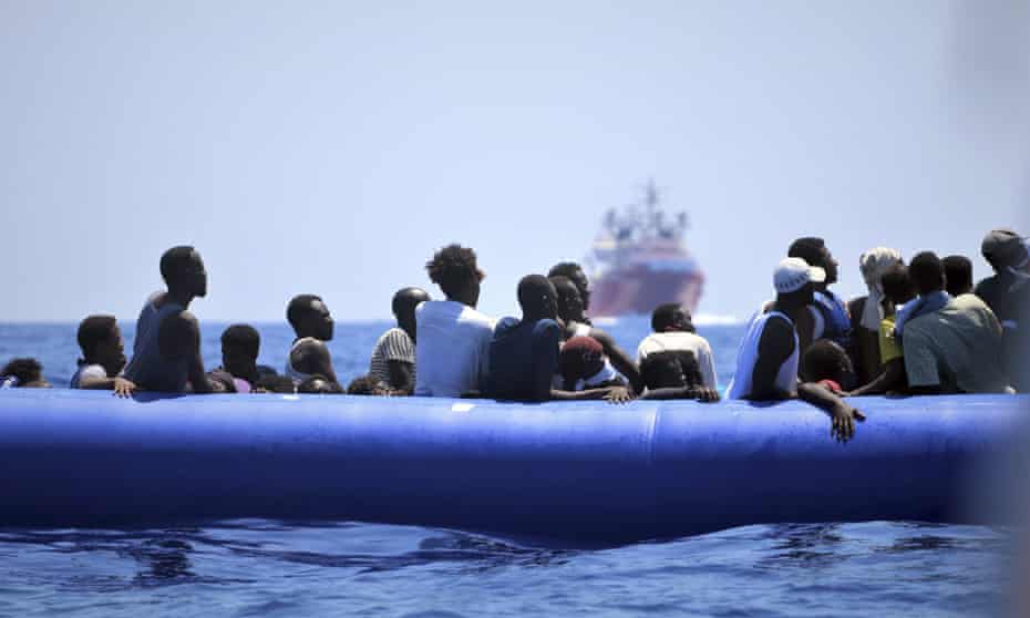 In this photo taken on 12 August 2019, migrants on a dinghy wait to be assisted by the Ocean Viking ship, operated by the NGOs SOS Méditerranée and Doctors Without Borders, in the Mediterranean Sea. 