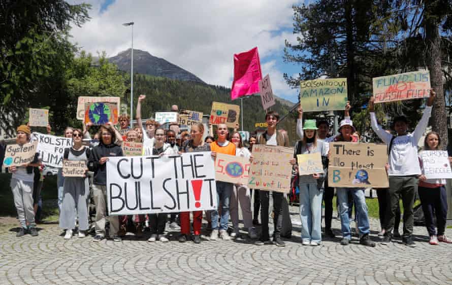 Activists from Fridays for Future hold a climate strike at World Economic Forum, in DavosClimate activists hold signs, during a Fridays for Future climate strike on the last day of the World Economic Forum (WEF), in the alpine resort of Davos, Switzerland May 26, 2022. REUTERS/Arnd Wiegmann