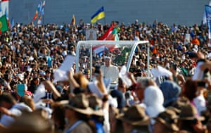 Devotees surround the popemobile as Francis heads to the Shrine of Our Lady of Fátima.