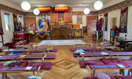 Floor mats, meditation cushions and gold-leafed Buddhist statues in the Tibetan Buddhist Centre’s converted barn