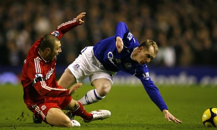 Andrea Dossena tangles with Everton’s Tony Hibbert during an FA Cup derby at Goodison Park in February 2009.