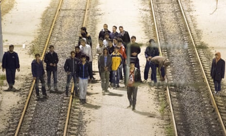 Migrants walking down the railway track to get to the Channel tunnel