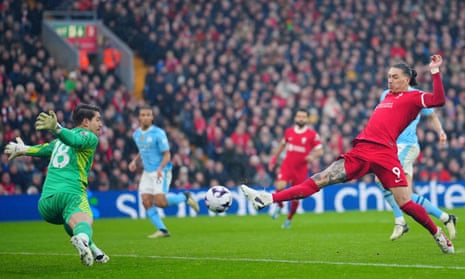 Liverpool's Darwin Nunez, right, makes an attempt to score but it’s saved by Manchester City's goalkeeper Stefan Ortega.
