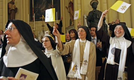 Cloistered nuns wave Vatican flags before Pope Benedict XVI’s visit to Jerusalem.