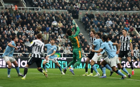 Newcastle United's Nick Woltemade heads at goal.