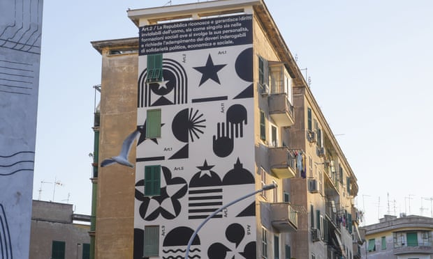 The second article of the Italian Constitution is seen painted on a building in Garbatella during the celebrations for the 76th anniversary of the proclamation of the Italian Republic.
