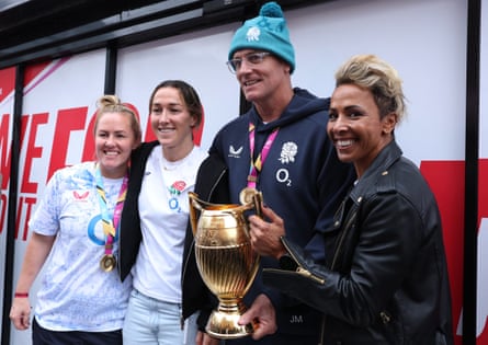England’s Marlie Packer, footballer Lucy Bronze, head coach John Mitchell and former Olympic champion Kelly Holmes during the title party
