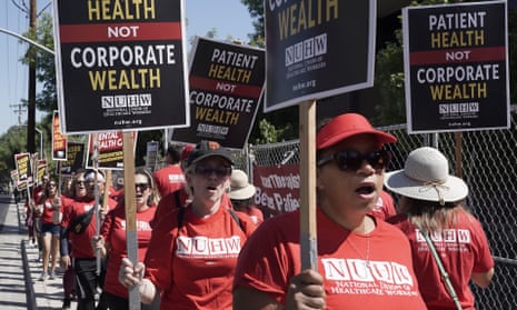 Kaiser Permanente mental health workers and supporters march outside a Kaiser facility in Sacramento, 15 August 2022. 