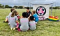 Coach Xavi Valdez speaking with youth players participating in our "Mini Soccer" program. All Gender, ages 4-6.