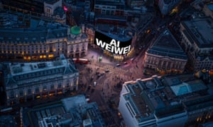 Ai Weiwei’s work is projected on to a screen at Piccadilly Circus (aerial shot).