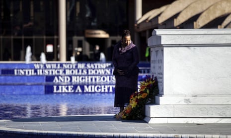 Dr Bernice King looks at the crypt of her parents after laying a wreath on Monday in Atlanta.