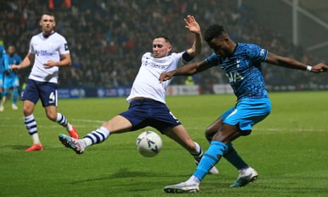 Tottenham Hotspur's English midfielder Ryan Sessegnon (R) crosses the ball as Preston's Irish midfielder Alan Browne (C) tries to block during the English FA Cup fourth round football match between Preston North End and Tottenham Hotspur at Deepdale