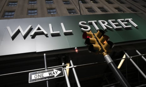 A sign for a Wall Street building is shown in New York.