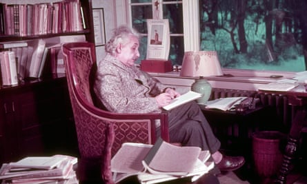 Albert Einstein at work in his study.