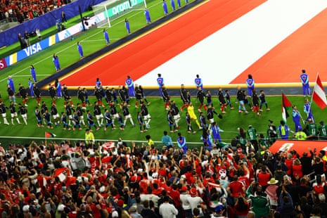 Austria and Jordan walk on to the pitch at San Francisco Bay Area Stadium
