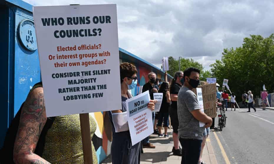 Residents demonstrate against a Cambridgeshire county council decision to close a bridge to all traffic except bicycles, pedestrians and buses.
