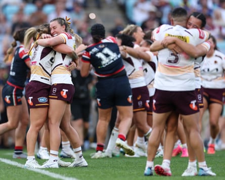 Brisbane Broncos players celebrate winning the NRLW grand final match against Sydney Roosters