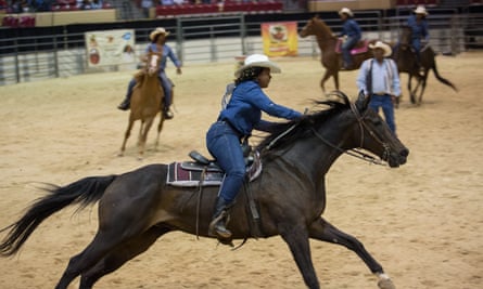 Pennie Brown of Cowgirls of Color gathers speed during the barrel relay