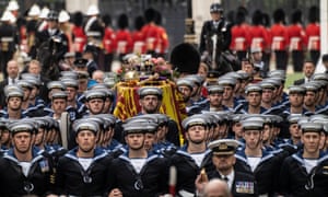 The state gun carriage carries the coffin of the Queen to Westminster Abbey