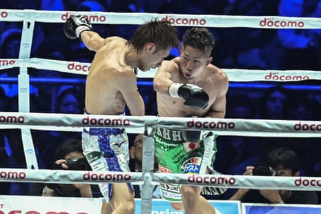 Takuma Inoue lands a right hand on Sho Ishida during their WBA bantamweight title fight at the Tokyo Dome.