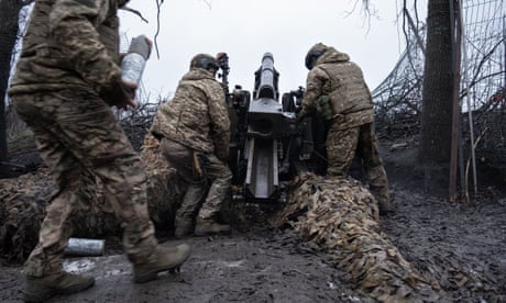 An artillery unit from Ukraine’s Khartiia Brigade prepare to fire a US-made M101A1 Towed Howitzer near a frontline in the Kharkiv region in January 2025