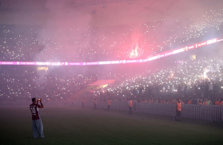 Mohamed Salah takes a photo of the fans