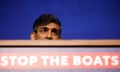 Rishi Sunak's head under a sign saying 'STOP THE BOATS'