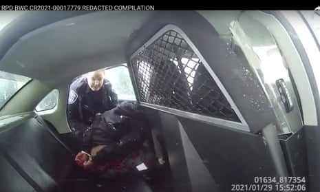 Police body camera video provided by the Rochester police department shows a police officer talking to a handcuffed nine-year-old in the back of a police car.