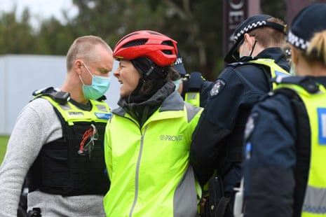 A person is detained during an anti-lockdown protest in Melbourne.