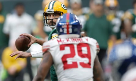 Aaron Rodgers has a pass on 4th down in the final quarter blocked by Giants free safety Xavier McKinney during the NFL London 2022 match between New York Giants and Green Bay Packers.