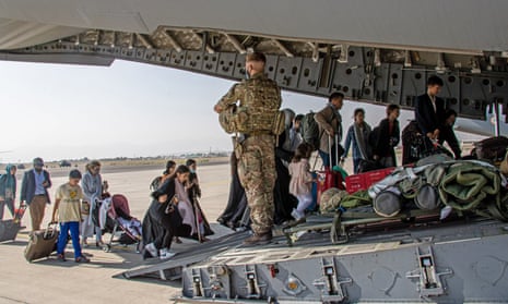 British citizens and dual nationals board a military plane for evacuation from Kabul airport on Monday