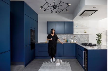 Sharon Toong in her kitchen with dark blue units