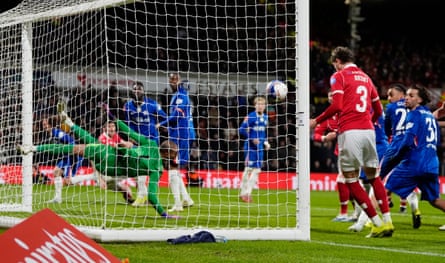 Wrexham’s Lewis Brunt heads in from close range