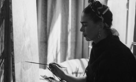 black and white picture of a woman painting