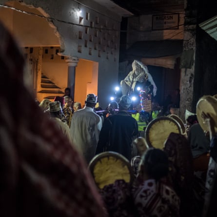 The groom is carried through the medina on the eve of the wedding