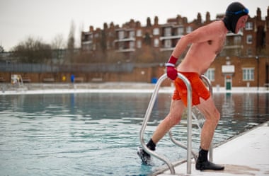 A swimmer braves the cold at Parliament Hill lido in mid-winter.
