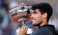 Carlos Alcaraz celebrates with the trophy after winning the French Open
