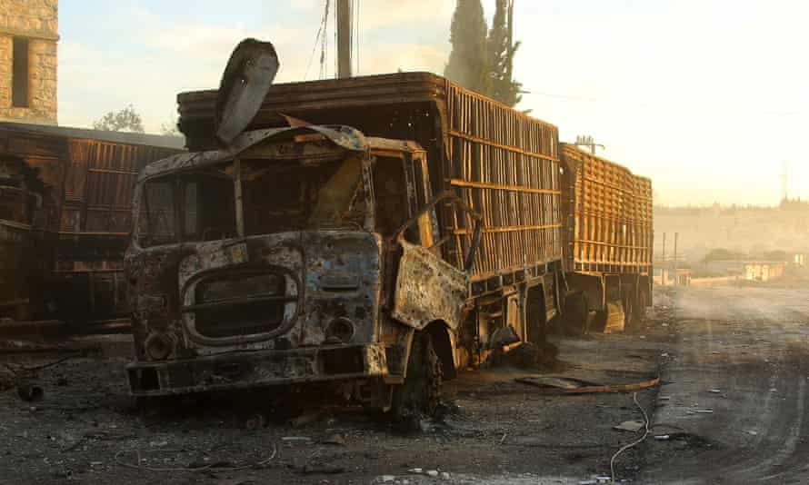 Damaged aid trucks are pictured after an airstrike on the rebel held Urm al-Kubra town, western Aleppo city.