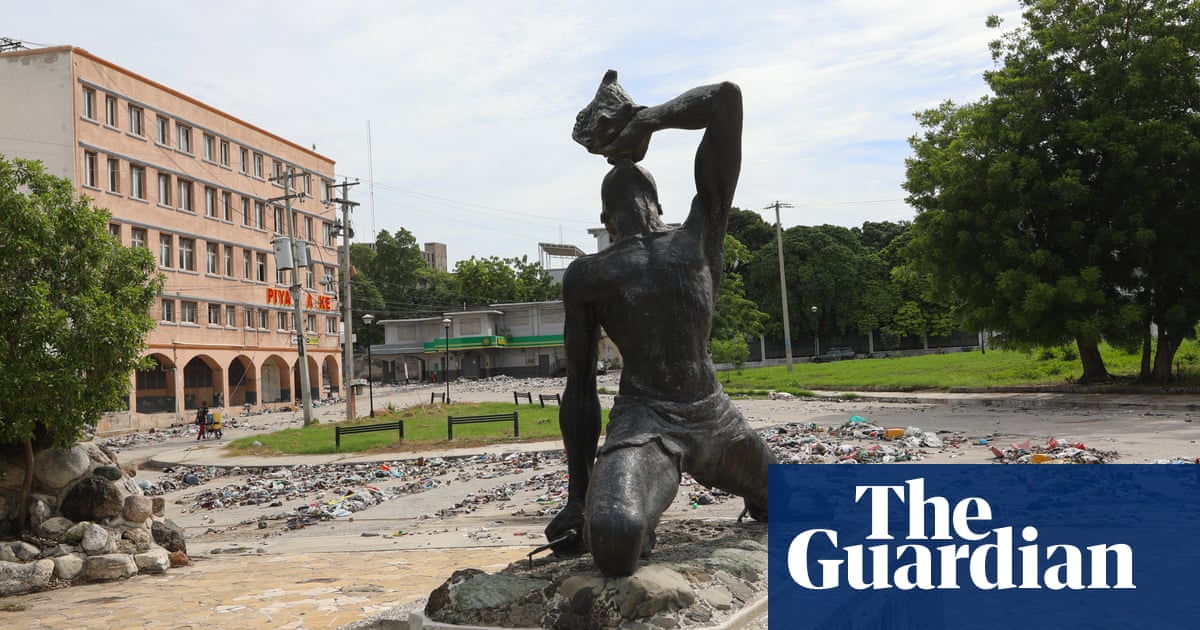 Battered statue bears witness to Haiti's tragedy, resilience and flickering hope