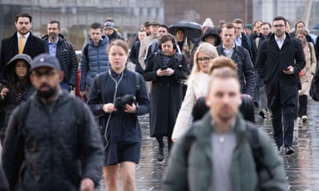 Commuters make their way to the office across London Bridge