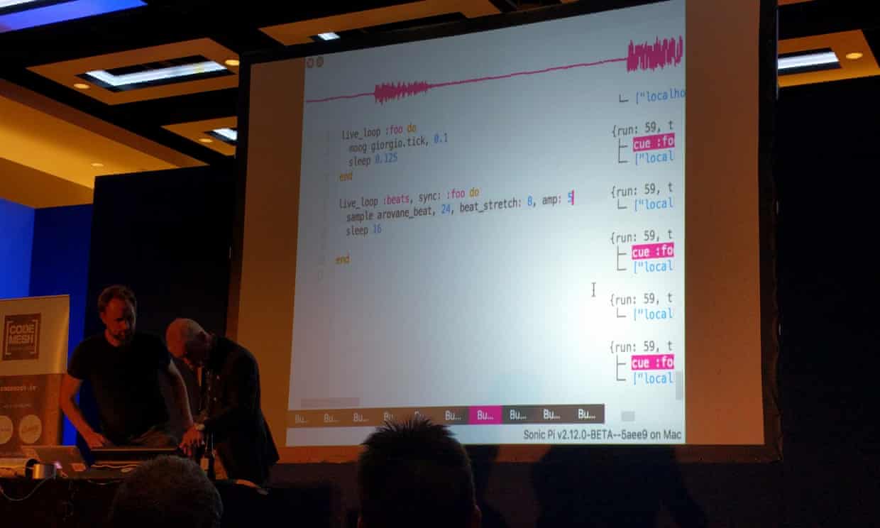 Code Mesh 2016 keynote ‘Distributed Jamming with Sonic Pi and Erlang’. Joe Armstrong adjusts a synth under instruction from Sam Aaron. The screen behind them shows Sonic Pi running.
