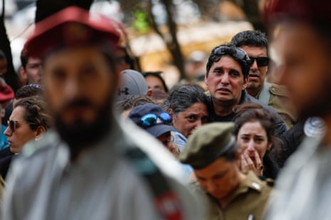 Friends and family mourn Matan Meir, 38, who was killed in the northern Gaza Strip, at his funeral in Odem, northern Israel.