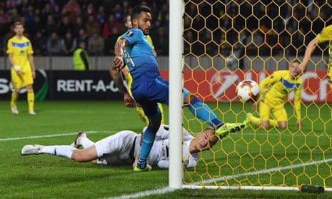 Arsenal’s Theo Walcott scores the opening goal past BATE’s goalkeeper Denis Scherbitski
