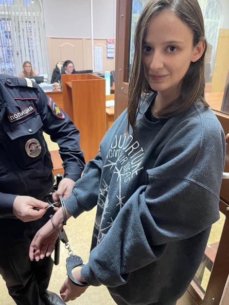 Lucy Shtein wearing handcuffs